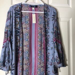 Francesca’s blue rain cardigan